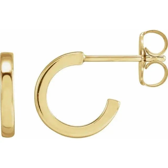 Close-up photo of 14K gold 10mm classic hoop earrings, handcrafted in NYC.