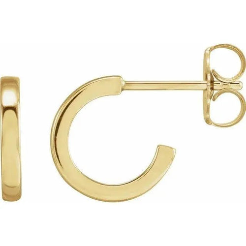 Close-up photo of 14K gold 10mm classic hoop earrings, handcrafted in NYC.