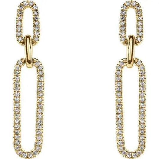 Close-up of diamond paperclip earrings with 1/3 carat total weight in yellow gold.