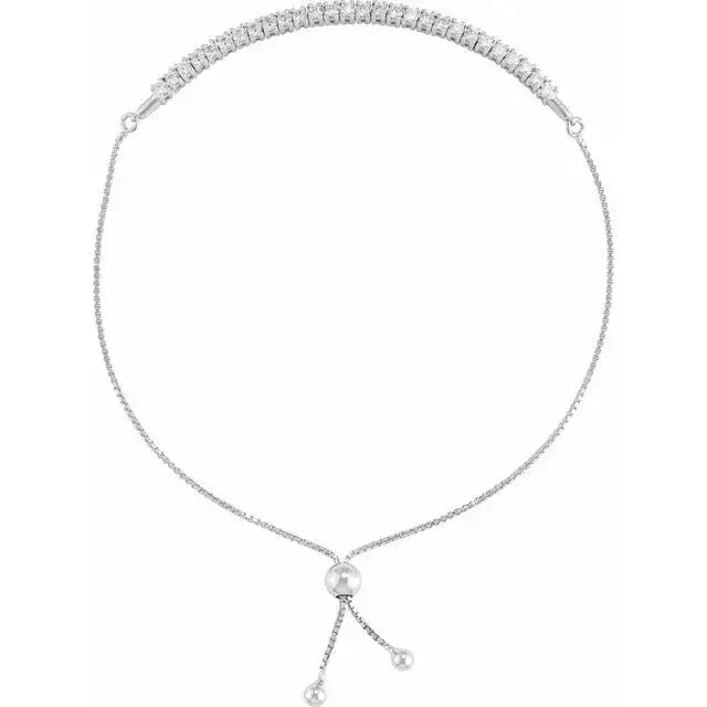 White gold 14K Bolo Bracelet featuring an adjustable slider and diamond accents. A sophisticated and modern jewelry piece for any wardrobe.