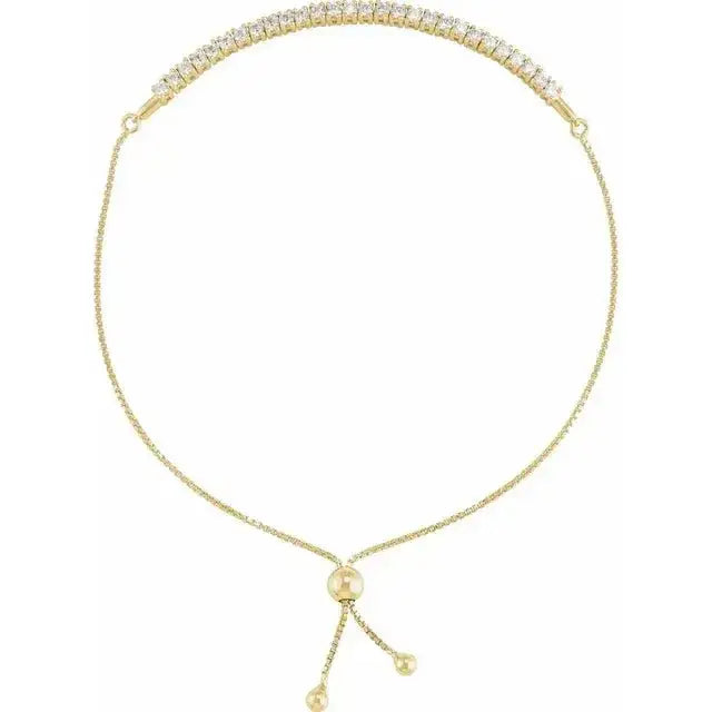 Close-up photo of 14K gold adjustable bolo bracelet with minimalist design, handcrafted in NYC.