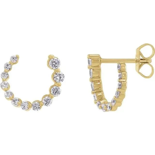 Close-up photo of 14K gold open-circle earrings with pavé-set natural diamonds, handcrafted in NYC.