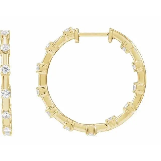 Close-up photo of 14K gold diamond hoop earrings with natural diamonds, handcrafted in NYC.