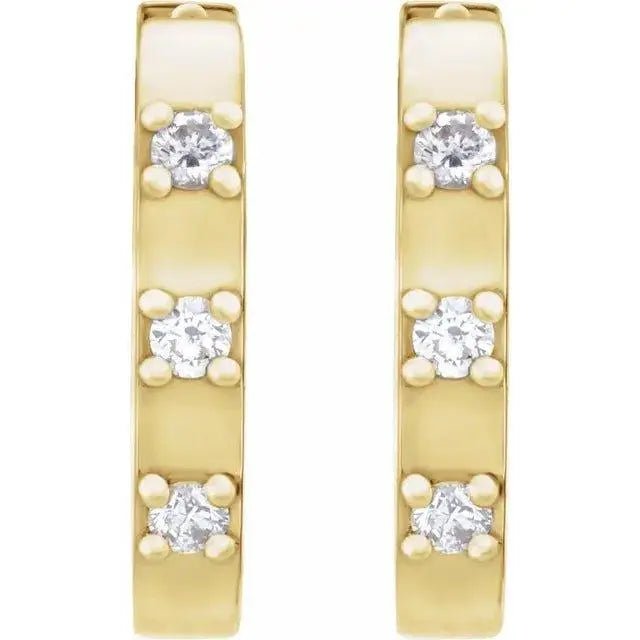 Yellow gold hoop earrings featuring natural diamonds