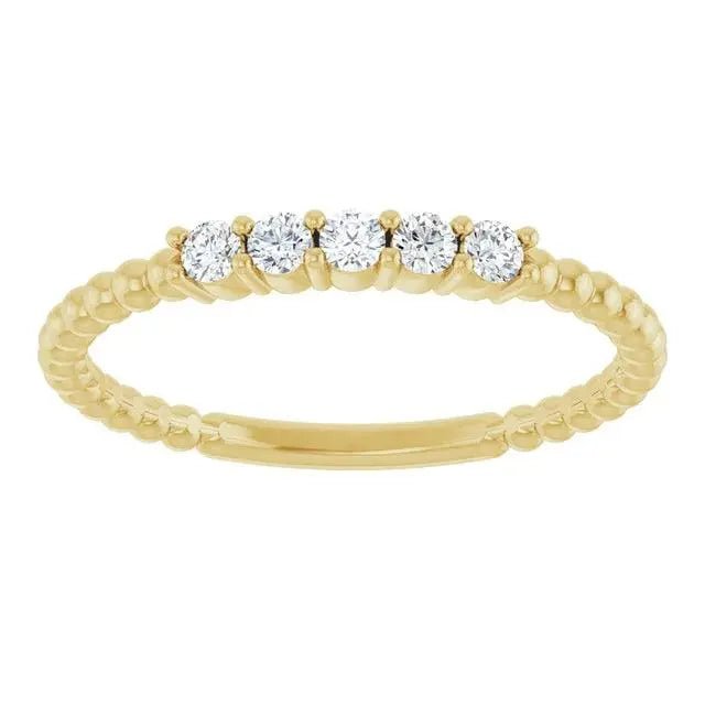 Yellow gold stackable ring featuring diamonds and bead details