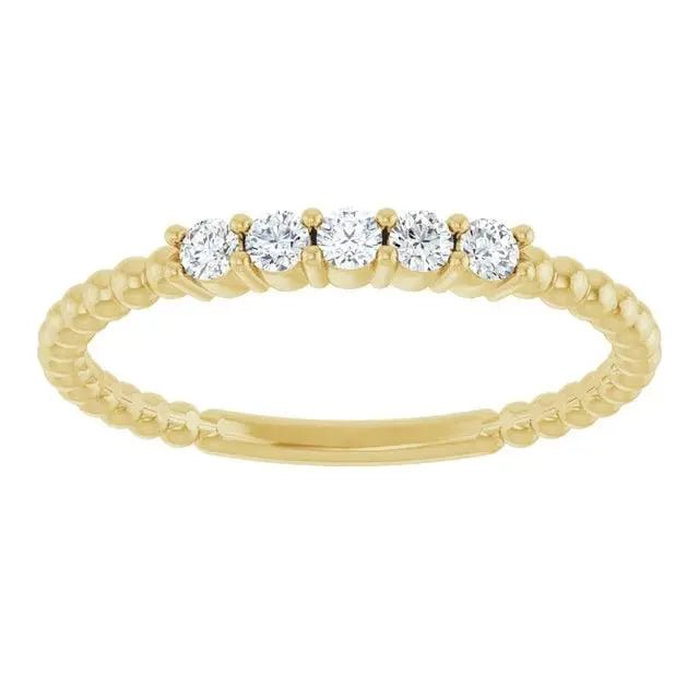 Front view of 14K yellow gold diamond stackable bead ring featuring five sparkling diamonds and a textured beaded band design.