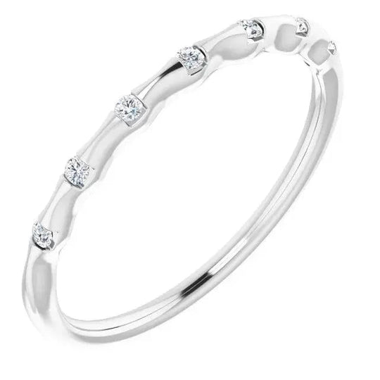 White gold stackable ring featuring elegant curves and diamonds