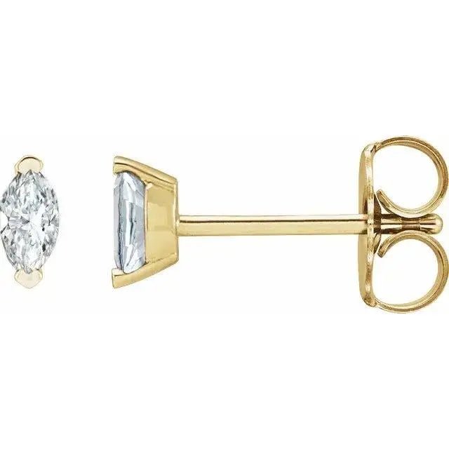 Close-up photo of 14K gold marquise diamond stud earrings with natural diamonds, handcrafted in NYC.