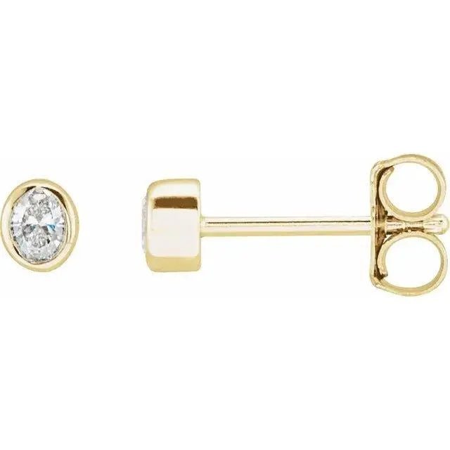 Close-up photo of 14K gold marquise diamond stud earrings with natural marquise-cut diamonds, handcrafted in NYC.