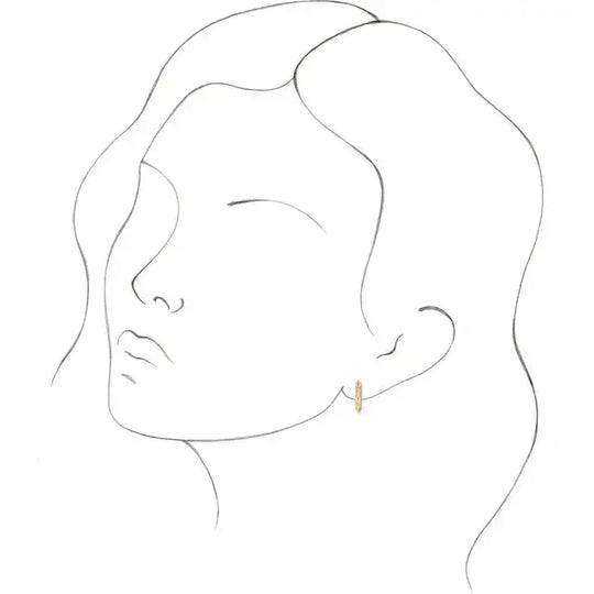 Illustration of a woman wearing 14K gold spike stud earrings, showcasing their size and fit. A stylish and edgy addition to any jewelry collection.