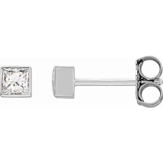 Close-up of square diamond stud earrings with sleek bezel design