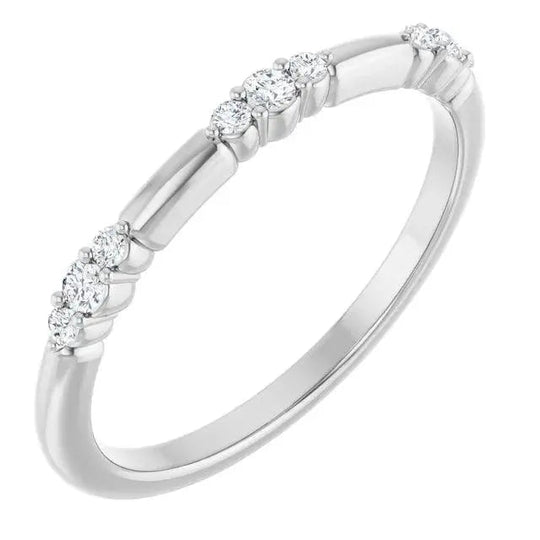 White gold 14K stationed diamond stackable ring with brilliant-cut diamonds along a sleek band. A sophisticated and versatile jewelry piece.