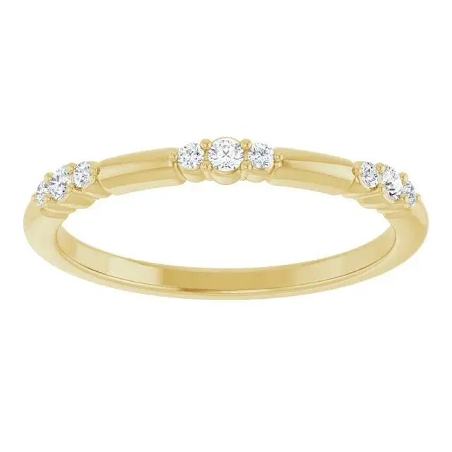 Elegant 14K gold stationed diamond stackable ring with sparkling diamonds set along a polished yellow gold band. A timeless luxury jewelry piece.