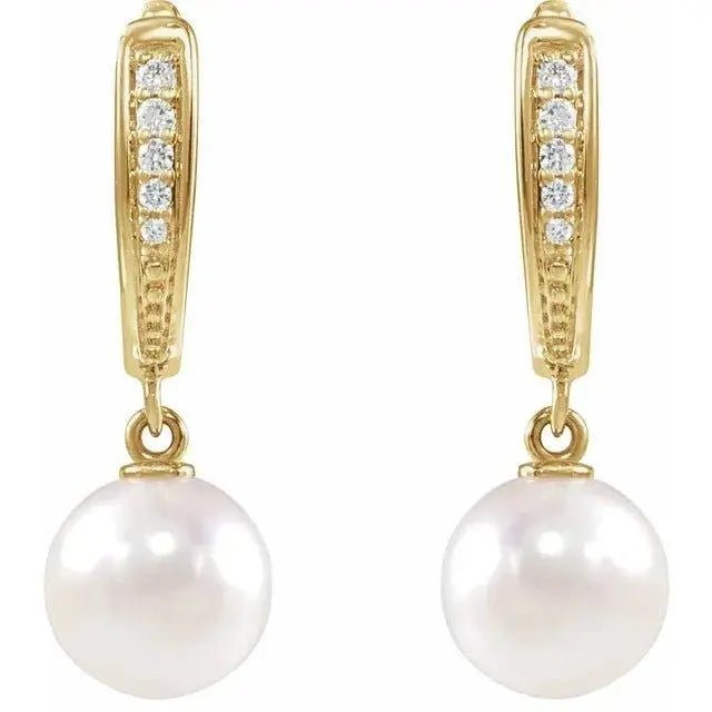 Close-up of pearl and diamond earrings in white gold