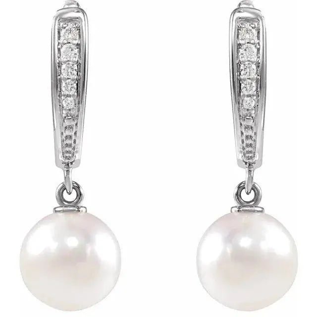White pearl and diamond drop earrings in 14K gold