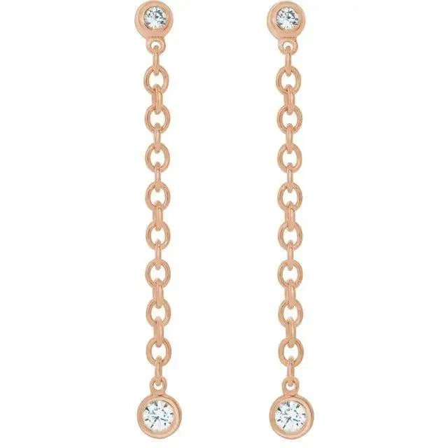 Close-up of diamond dangle earrings with modern chain design