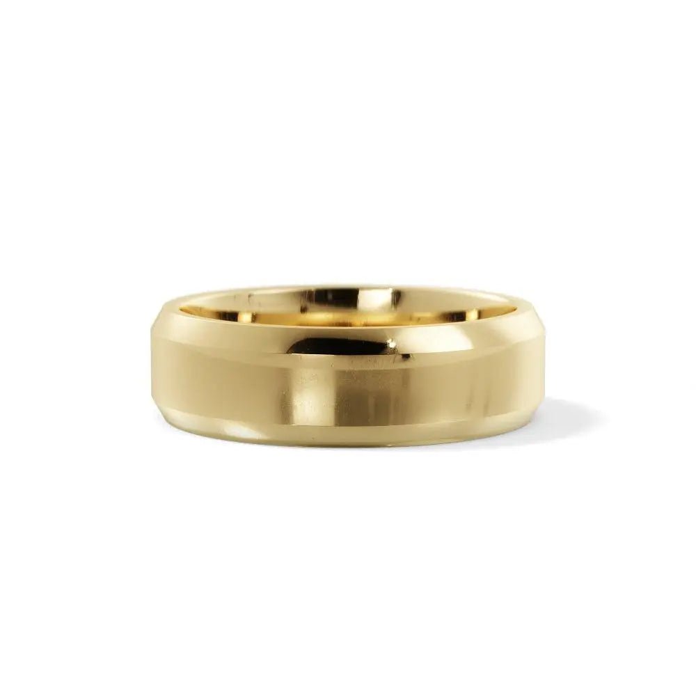 Close-up photo of a beveled edge gold wedding ring, 5 mm wide, handcrafted in NYC.