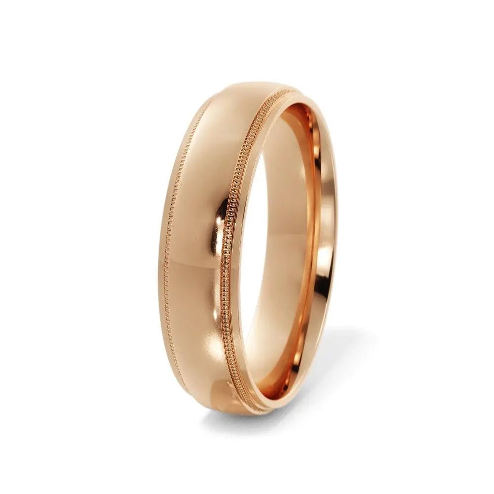 Classic polished 10K gold wedding ring – side view.