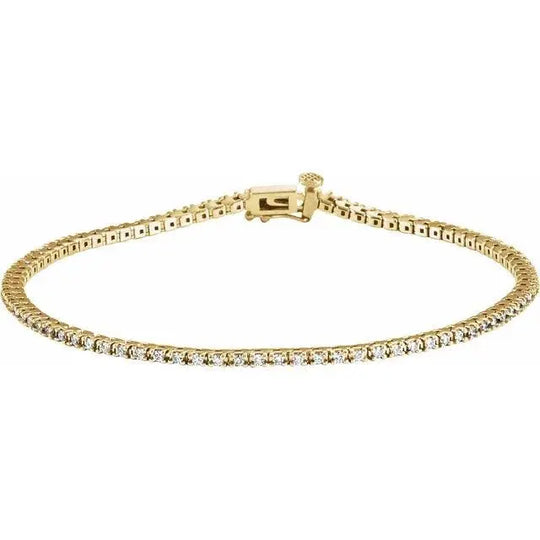 Elegant lab-created diamond tennis bracelet in yellow gold, featuring a classic clasp.