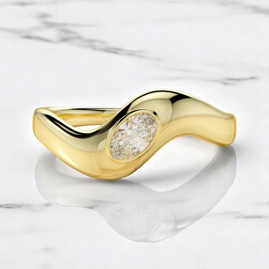 14K yellow gold sculpted ring with bezel-set oval lab-grown diamond, handcrafted by Dimitrios Creations
