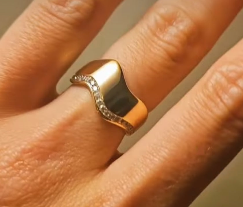 Eros wave ring in 14k gold on a finger by Dimitrios Creations