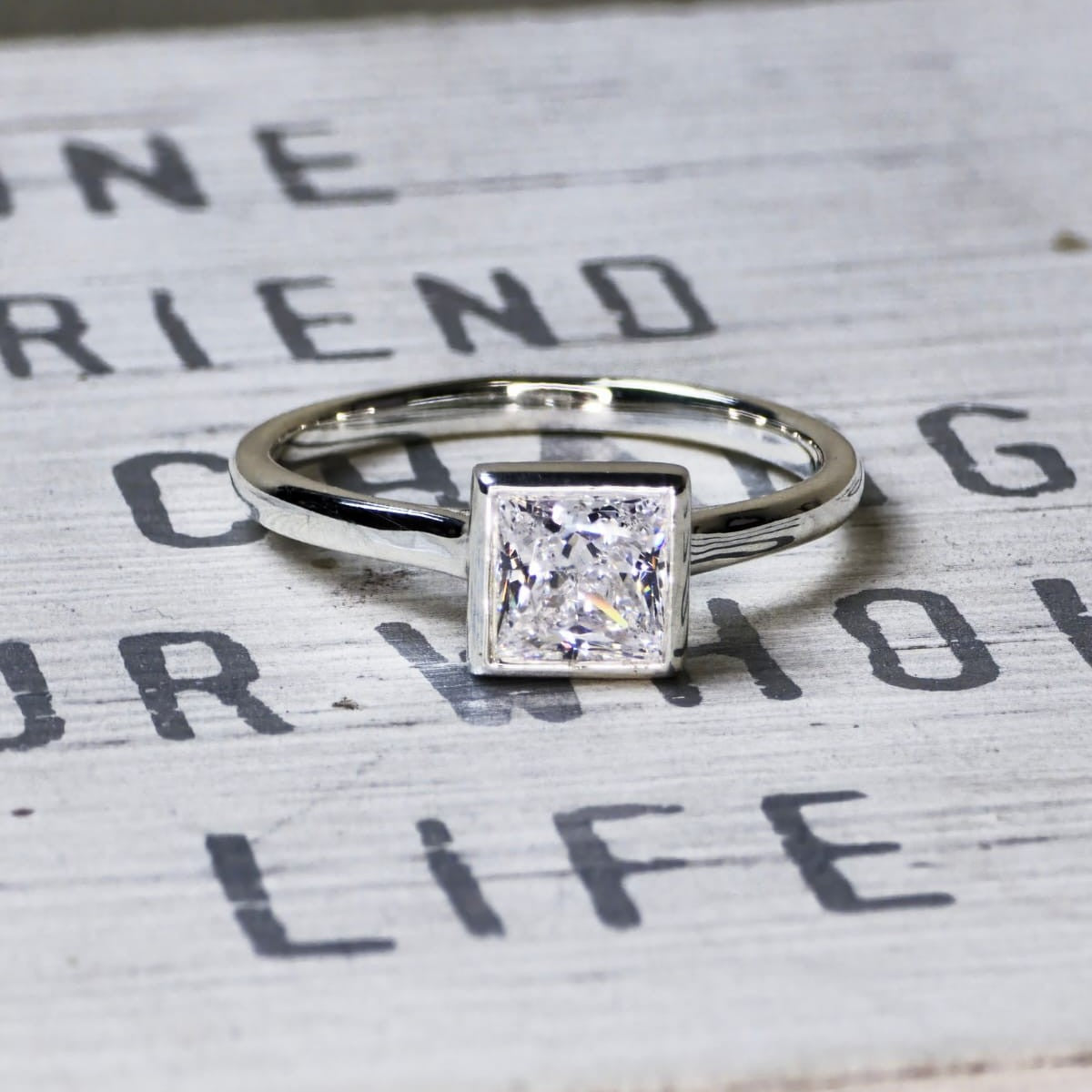 1 carat lab grown square diamond bezel engagement ring in 14K white gold