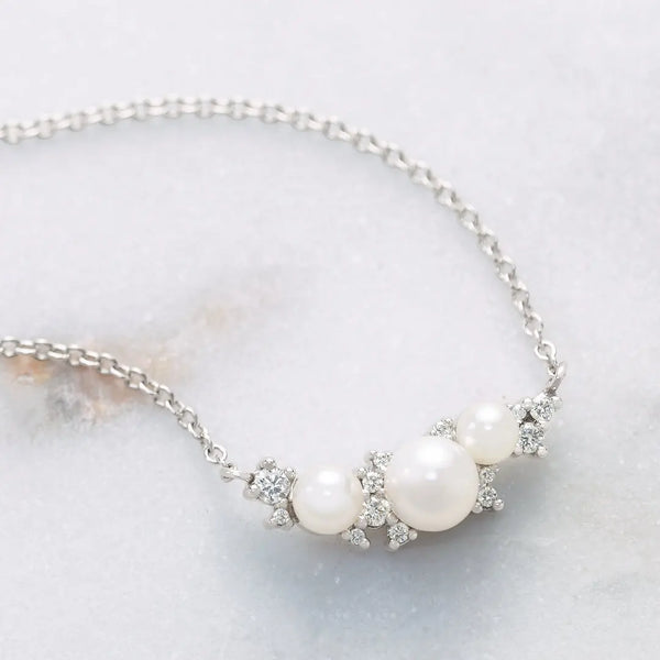 Pearl necklace adorned with diamonds