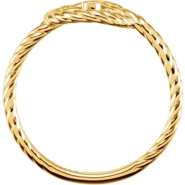 Side view of the Amara Knot 14K gold love knot ring, showcasing its intricate twisted band and elegant craftsmanship.