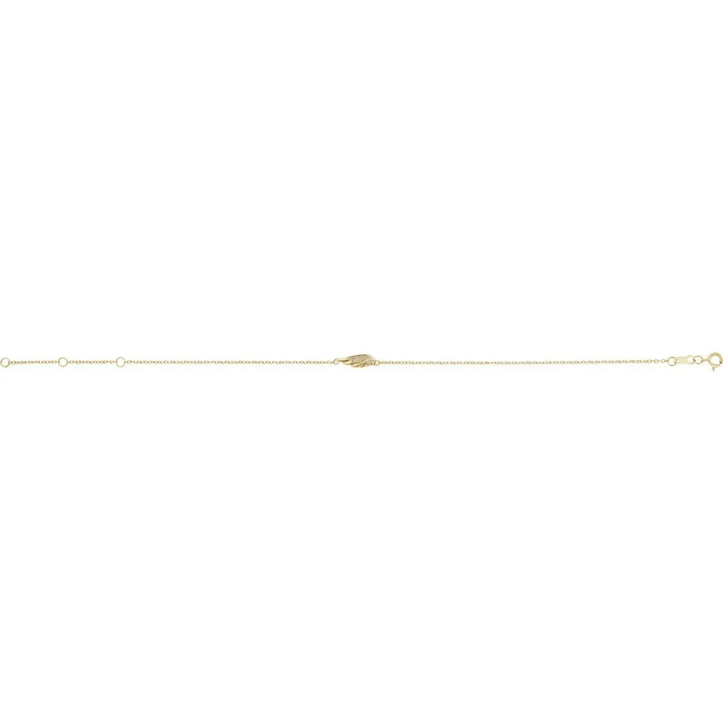 Minimalist angel wing bracelet in 14K gold with diamond accents. Adjustable chain design for a perfect fit, crafted with precision and elegance.
