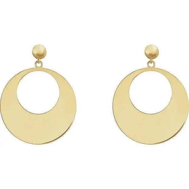 Handcrafted gold earrings featuring polished disc pendants