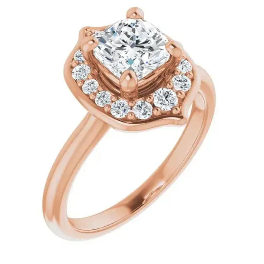 Rose gold cushion diamond engagement ring with a floral halo design, blending vintage charm with modern elegance for a timeless look.