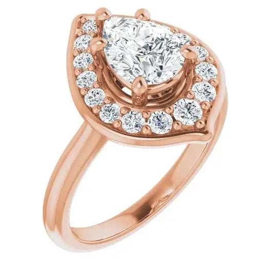 Romantic pear diamond engagement ring in rose gold with a blooming flower halo setting. A handcrafted floral-inspired design for timeless elegance.