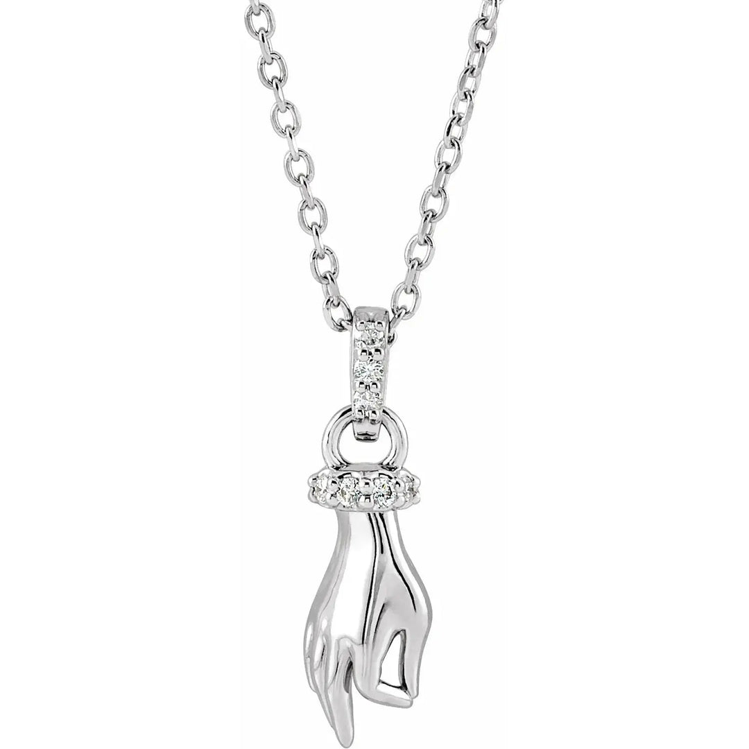 Buddha Hand Diamond Necklace in 14K white gold with a spiritual hand motif, adorned with a diamond-accented ring and bail for an elegant touch.