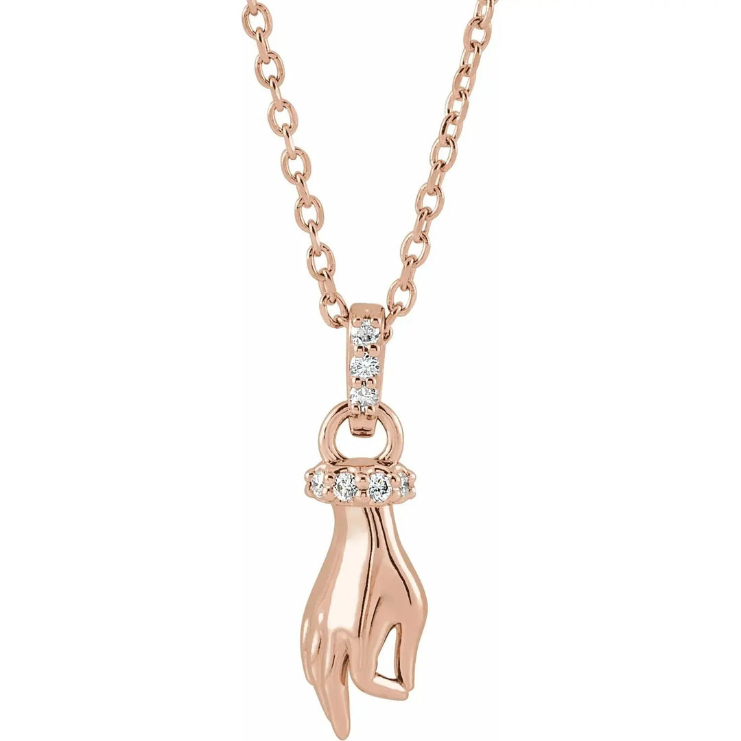 Buddha Hand Diamond Necklace in 14K rose gold, featuring a graceful hand pendant with diamond embellishments, symbolizing spirituality and elegance.