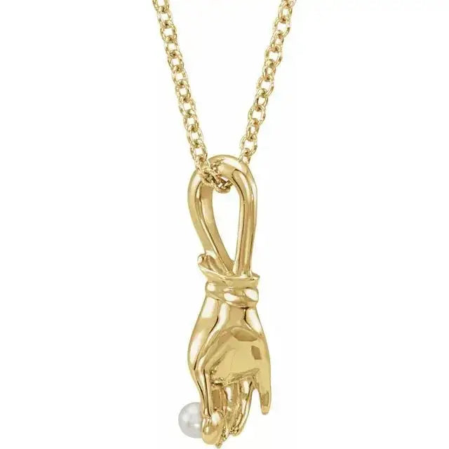 Buddha hand pearl necklace in 14K gold