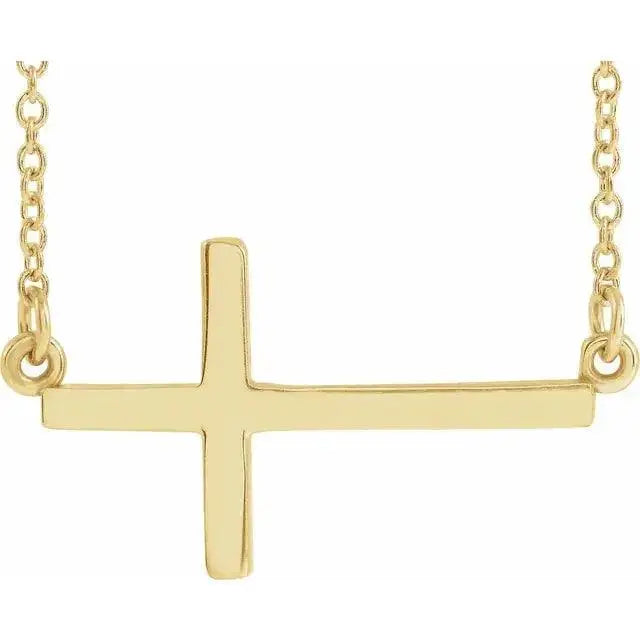 Classic Sideways Cross Necklace in 14K gold featuring a minimalist faith-inspired design. A modern and elegant jewelry piece symbolizing faith and love.