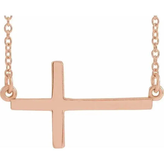 Classic Sideways Cross Necklace in 14K rose gold with a minimalist and modern design. A timeless faith-inspired jewelry piece for everyday elegance.