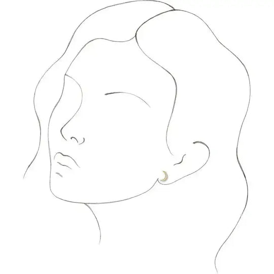 Illustration of a woman wearing diamond crescent moon earrings, showcasing their elegant fit. A celestial-inspired jewelry piece in 14K gold.