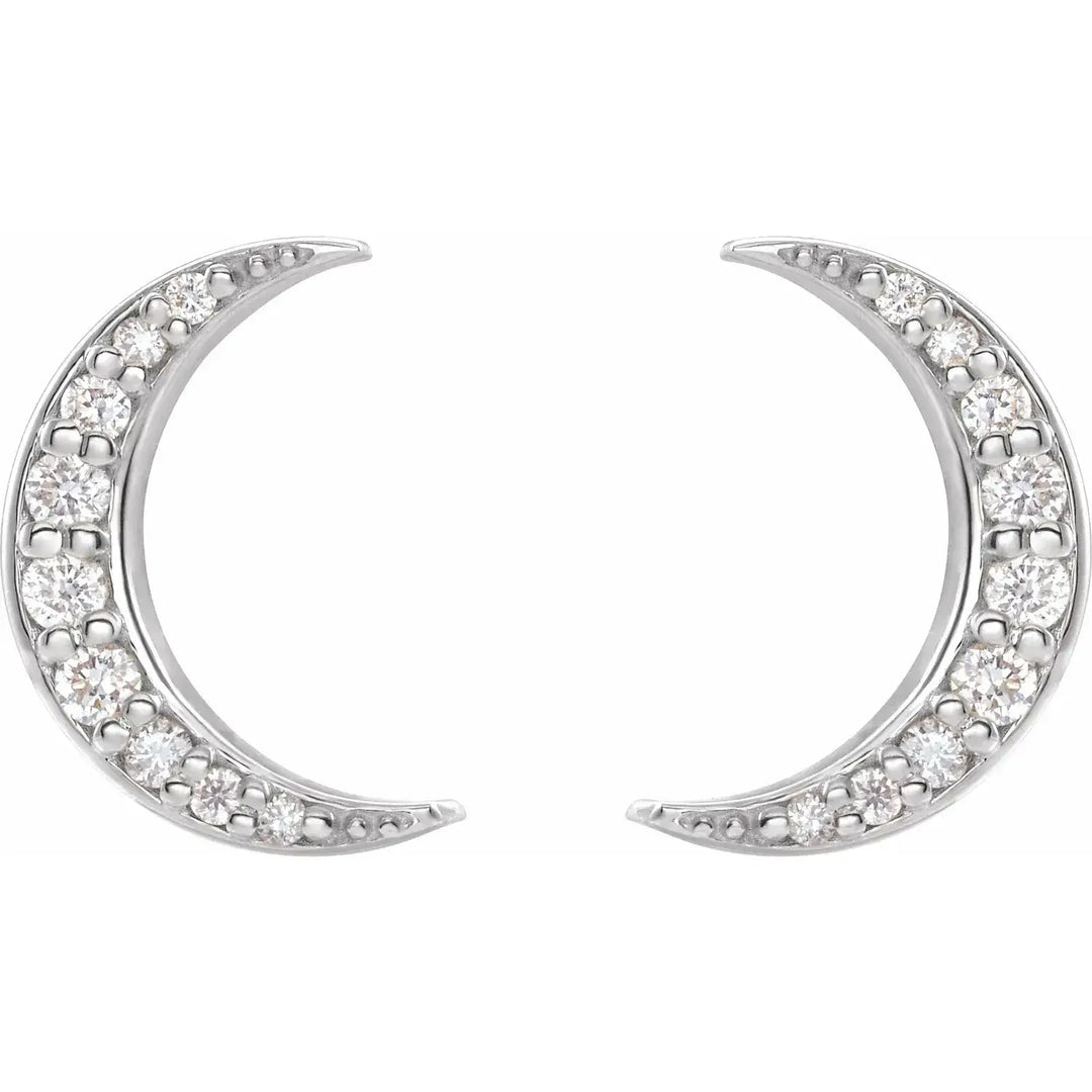 Diamond crescent moon earrings in 14K white gold, adorned with natural diamonds. A sophisticated celestial jewelry piece for elegant styling.