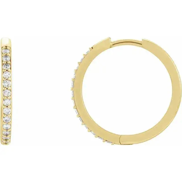 Close-up photo of 18mm 14K gold hoop earrings set with natural diamonds, handcrafted in NYC.