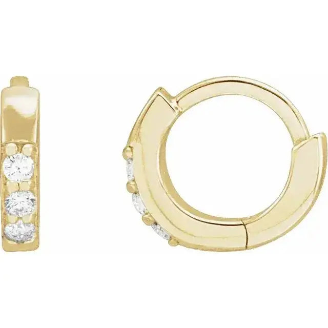 Close-up photo of 12mm 14K gold hoop earrings with natural diamonds, handcrafted in NYC.