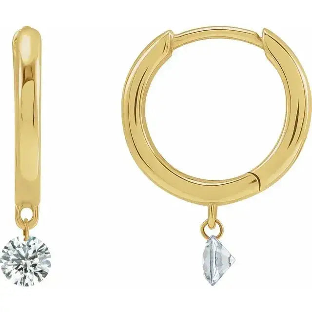 Close-up photo of 12mm 14K gold hoop earrings with drilled natural diamonds, handcrafted in NYC.