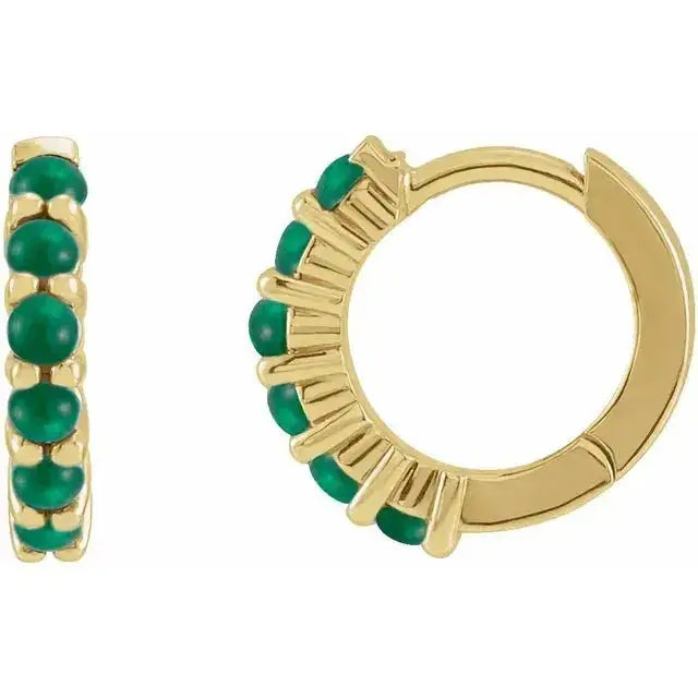 Emerald cabochon hoop earrings in 14K yellow gold, featuring vibrant green gemstones in a sleek, luxurious design for timeless elegance.