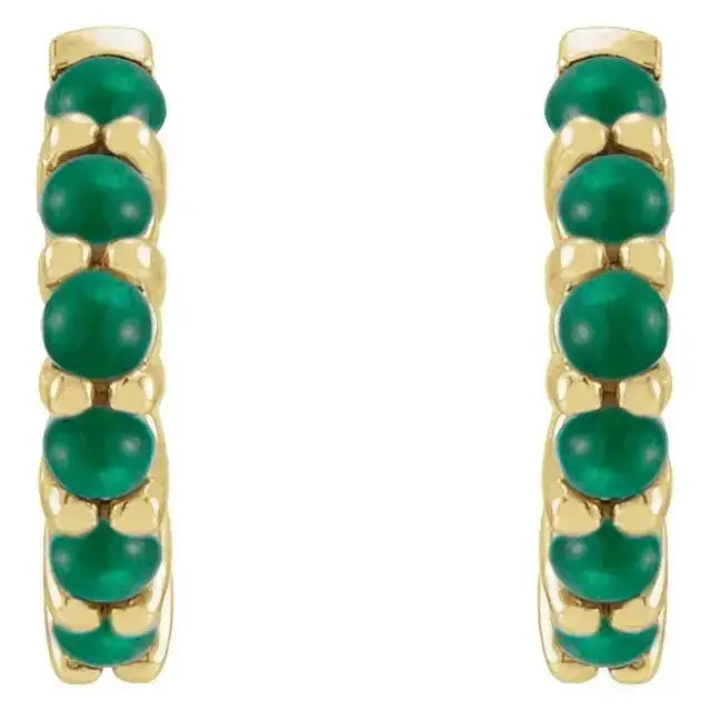 Front view of 14K yellow gold emerald cabochon hoop earrings, showcasing a row of vivid green gemstones for a refined and elegant look.