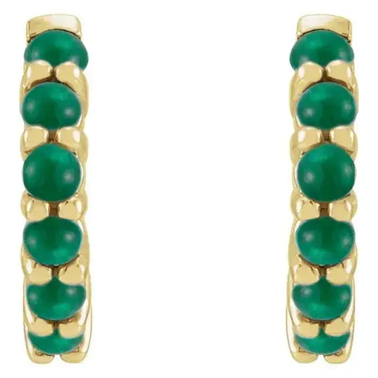 Front view of 14K yellow gold emerald cabochon hoop earrings, showcasing a row of vivid green gemstones for a refined and elegant look.