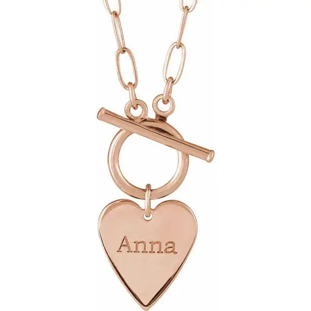 14K gold Heart Necklace, showcasing its elegant design and perfect fit around the neckline.