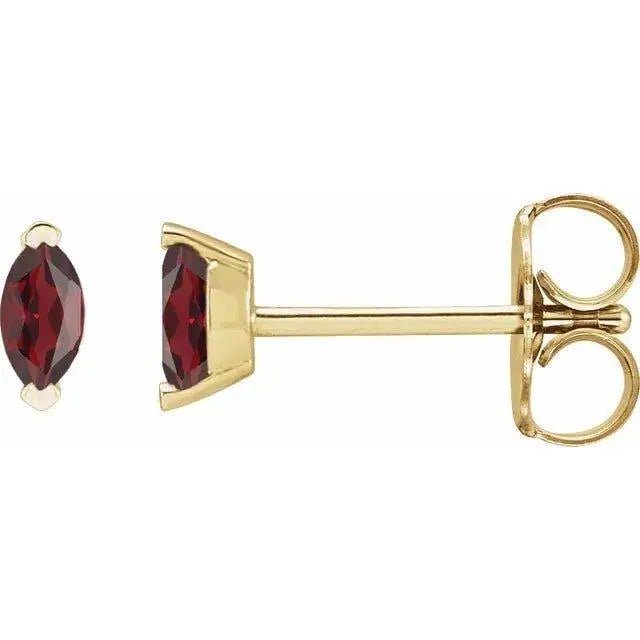 Close-up photo of 14K gold marquise garnet earrings with natural deep red garnets, handcrafted in NYC.