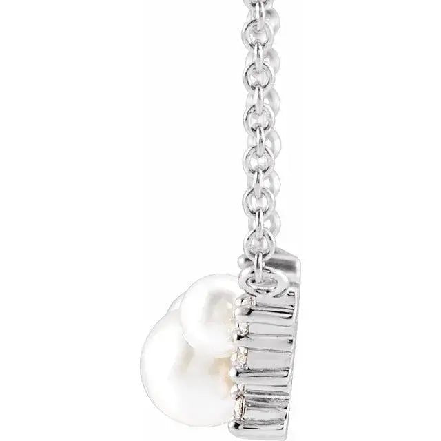 Elegant pearl and diamond pendant necklace in sterling silver