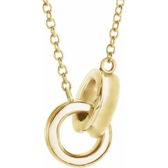 Close-up photo of 14K gold interlocking circle necklace, handcrafted in NYC.