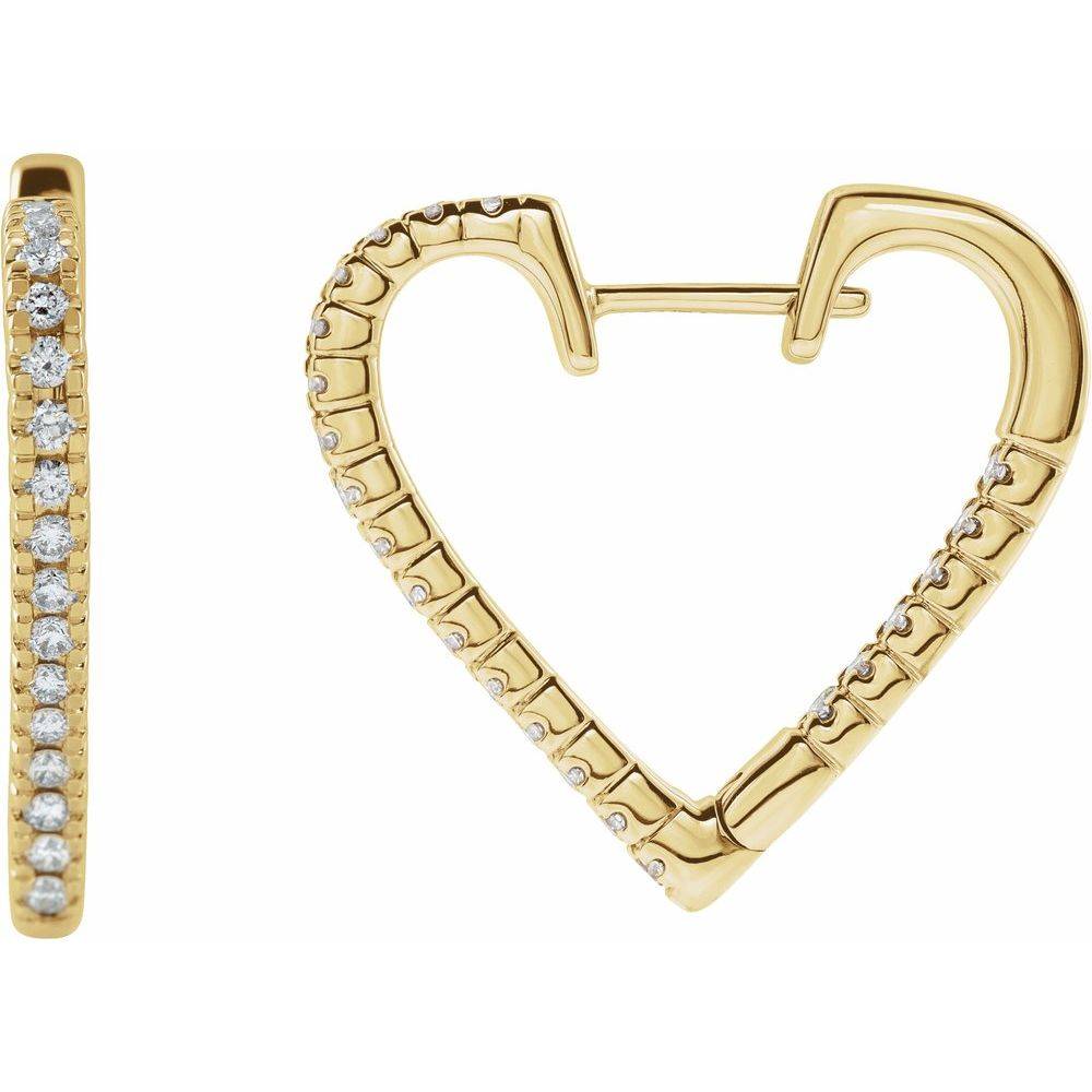 Heart-shaped hoop earrings displayed on a soft jewelry pouch, emphasizing their luxurious shine and craftsmanship.